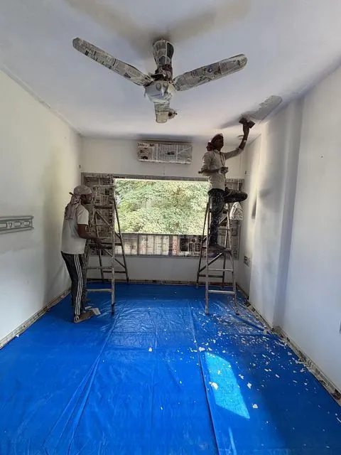 Ceiling painting with protective covering