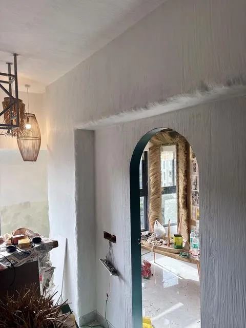 Textured wall with arch doorway