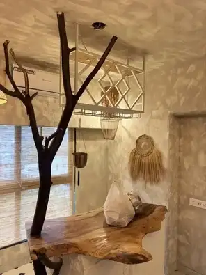 Rustic textured dining area with tree trunk