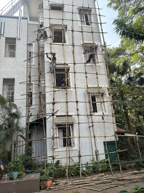 Building exterior painting with scaffolding